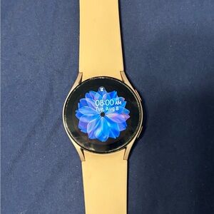 Samsung S2 Rose Gold Smartwatch with USB charger.